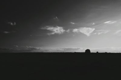 Silhouette of landscape against sky at sunset