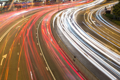 High angle view of light trails on highway at night