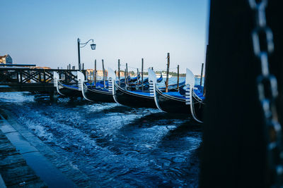 Boats moored in water