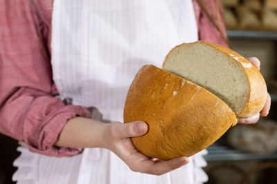 Midsection of man holding food