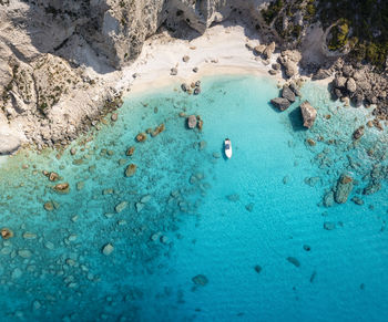 High angle view of rocks in sea