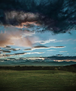Scenic view of dramatic sky over land