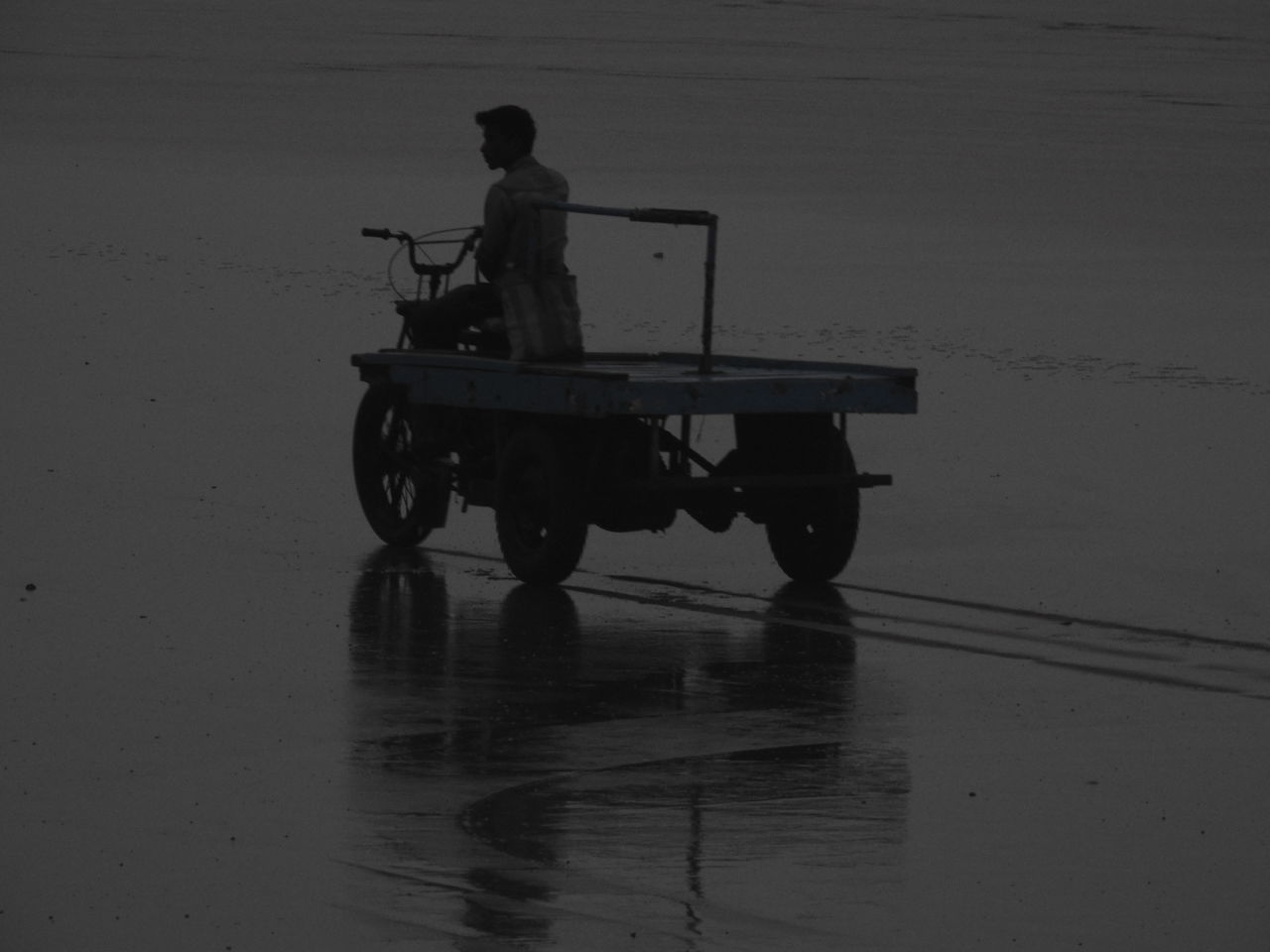 MEN ON BOAT AGAINST SKY