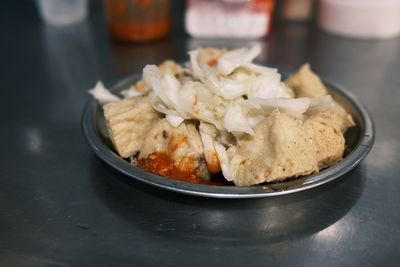 Close-up of food in plate on table
