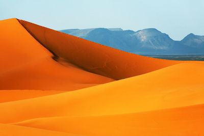 Scenic view of desert against clear sky