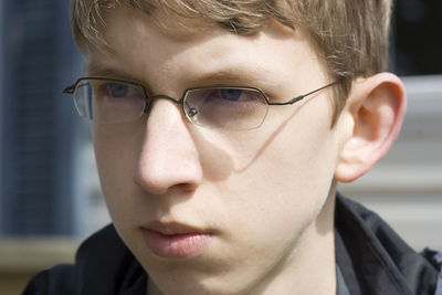 Close-up of teenager wearing eyeglasses