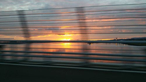 Scenic view of sea against sky at sunset