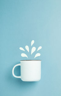 Close-up of coffee cup against white background