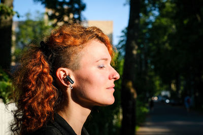 Thoughtful young woman looking away