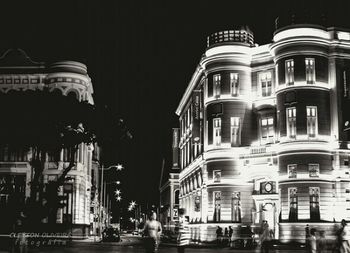 Buildings in city at night