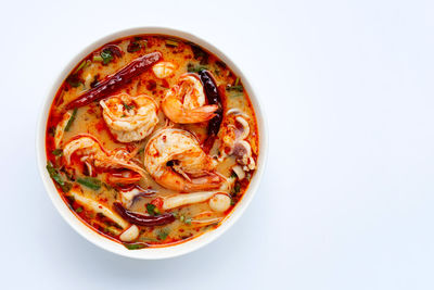 Directly above shot of noodles in bowl against white background