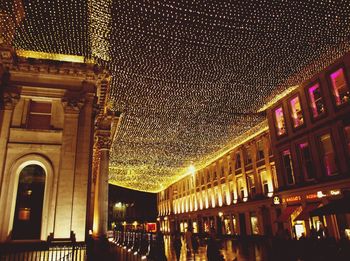 Low angle view of illuminated building at night