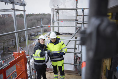 Engineers talking at building site