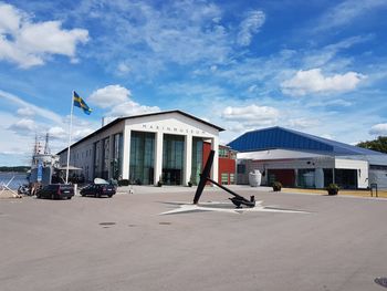 View of buildings in city against blue sky