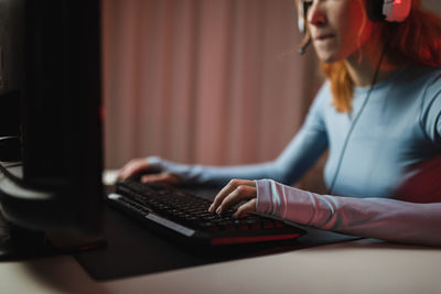 Midsection of woman working on table