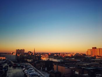 Cityscape against sky during sunset