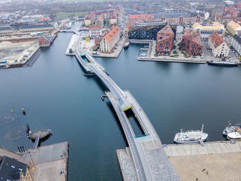 High angle view of harbor and buildings in city