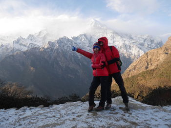 Man standing on snowcapped mountain