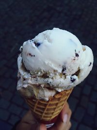 Close-up of cropped hand holding food