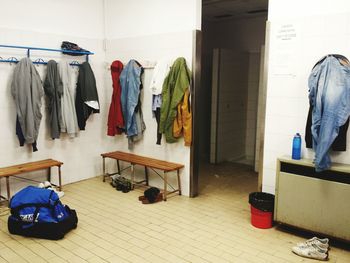 Clothes hanging on racks in changing room