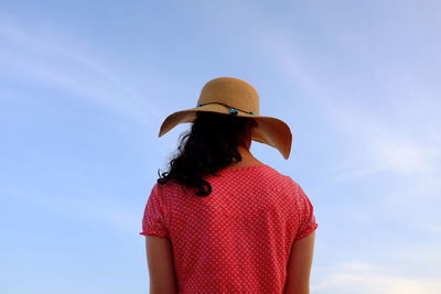 Silhouette of woman standing against sky