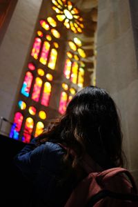 Midsection of woman at illuminated building