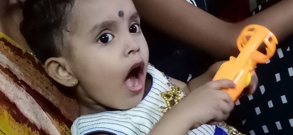 Close-up portrait of cute boy looking away