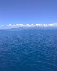 Scenic view of sea against blue sky