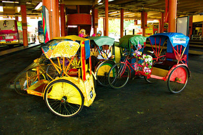 Bicycles on street against buildings in city