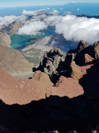 Aerial view of rocks on land against sky