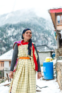 Full length of woman standing on mountain