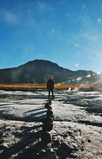 Man standing on snow covered landscape