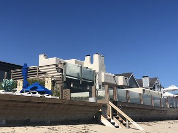 Low angle view of buildings against blue sky