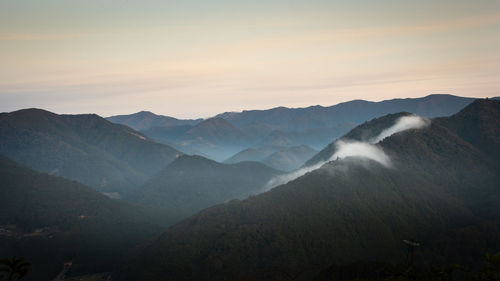 Scenic view of mountains against sky during sunset