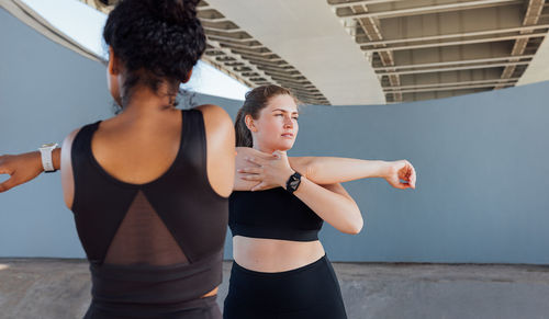 Young woman exercising in gym