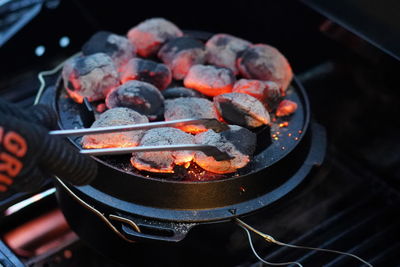 High angle view of hot embers on barbecue grill