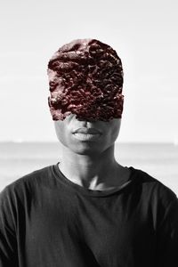 Portrait of young man against white background
