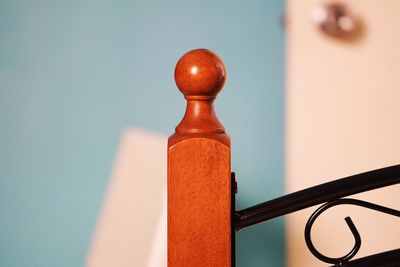 Close-up of red light on table against wall