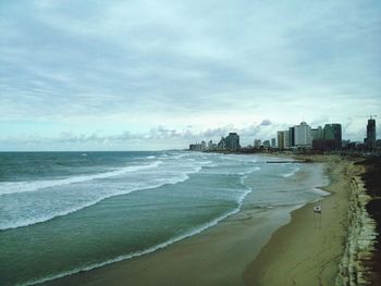 Scenic view of sea against cloudy sky