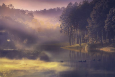 Scenic view of lake against sky during sunset