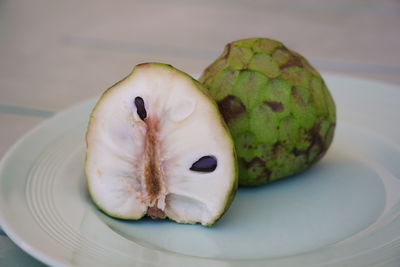 High angle view of fruits in plate on table