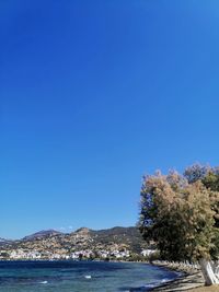 Scenic view of sea against clear blue sky