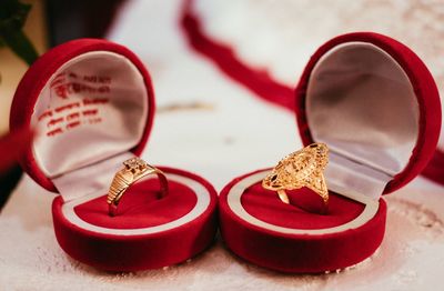 Close-up of wedding rings on table