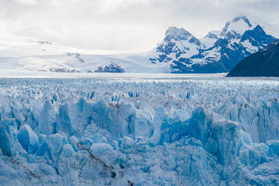 Scenic view of frozen lake against sky