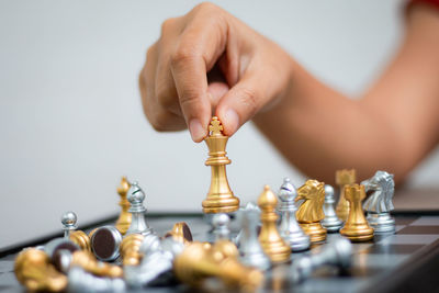 Cropped image of woman playing chess