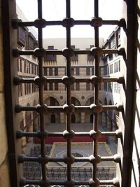 Close-up of metal grate window in building