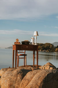 Old desk. work table with a beautiful landscape. desk with books, clock, lamp. nomad life.