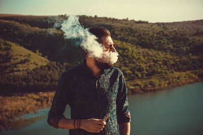 Man standing by lake