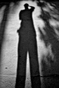 Shadow of people on street