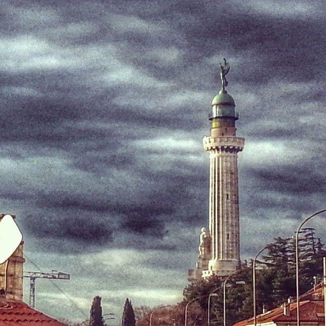 architecture, built structure, sky, building exterior, tower, cloud - sky, low angle view, tall - high, cloudy, communications tower, international landmark, famous place, capital cities, travel destinations, city, communication, tourism, cloud, spire, travel